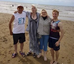 Travis with older siblings.
