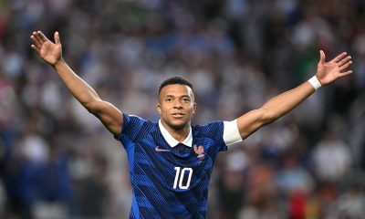 france-shines-with-a-mbappe-brace-in-a-rain‑soaked-match