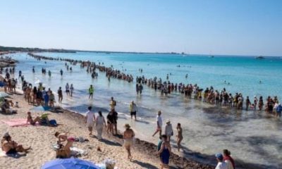 watch:-10,000-people-form-impressive-human-chain-to-save-mallorca-beach-from-becoming-‘magaluf-of-the-south’