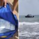 beachgoers-find-shopping-bags-full-of-cash-floating-on-shore
