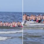 polish-beachgoers-form-human-chain-in-seconds
