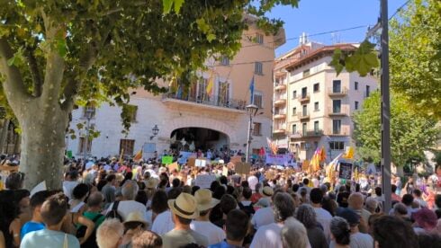 Anti-tourism protestors in a crowded square in Soller, Mallorca