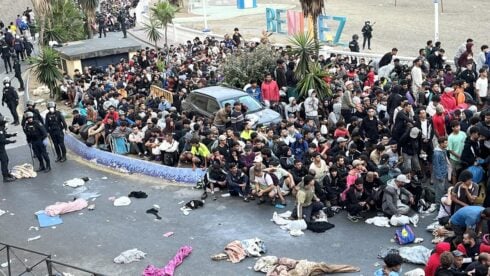 watch:-police-charge-at-migrants-in-ceuta-as-hundreds-stampede-through-streets-towards-new-temporary-shelter