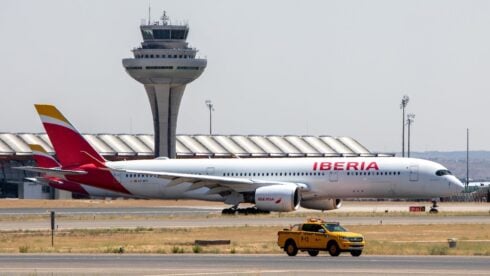 A red and white civilian airliner from Iberia