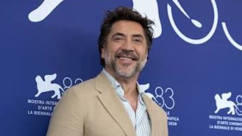 Javier Bardem in a beige suit at a festival