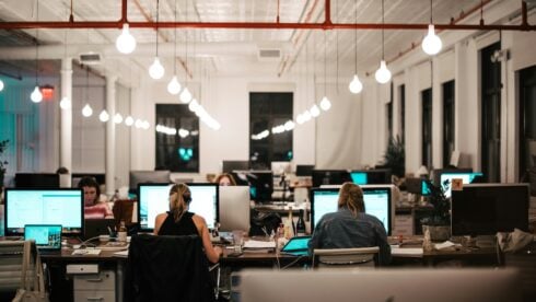 Tech employees working in a modern office